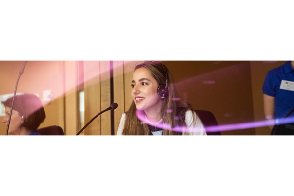 A young woman in an interpretation booth during the Open Doors Day